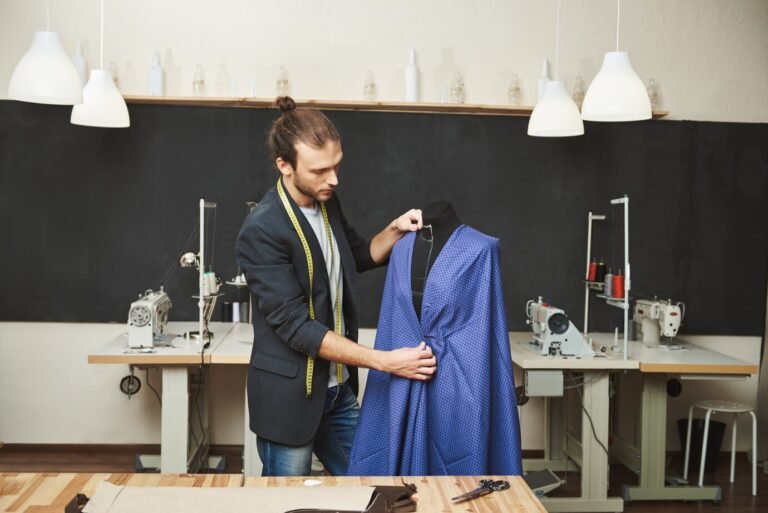 Navy custom suit on a wide-shouldered cedar hanger beside a horsehair clothes brush and breathable garment bag